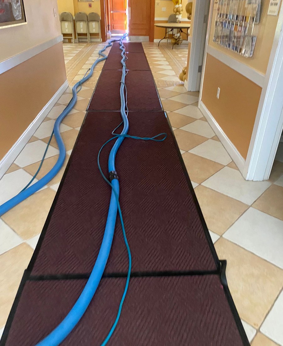 Commercial carpet extraction equipment during a cleaning project